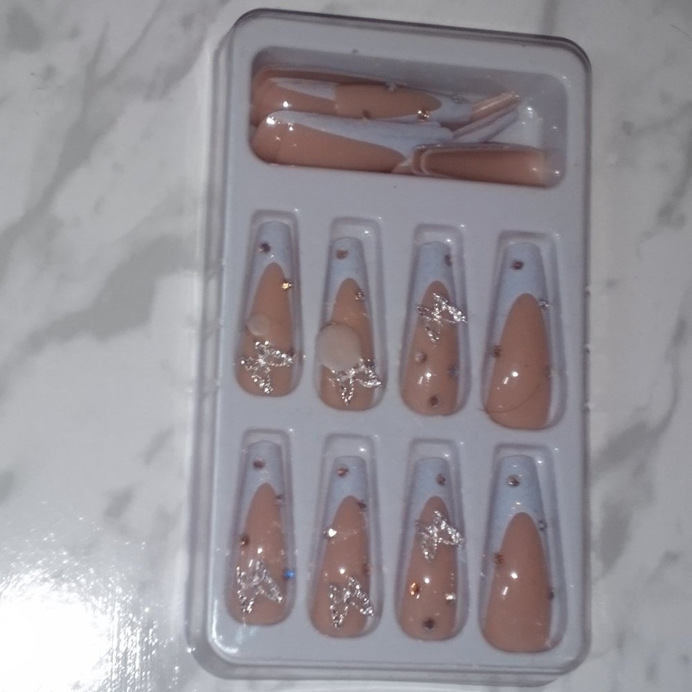 Long white tip butterfly nails
